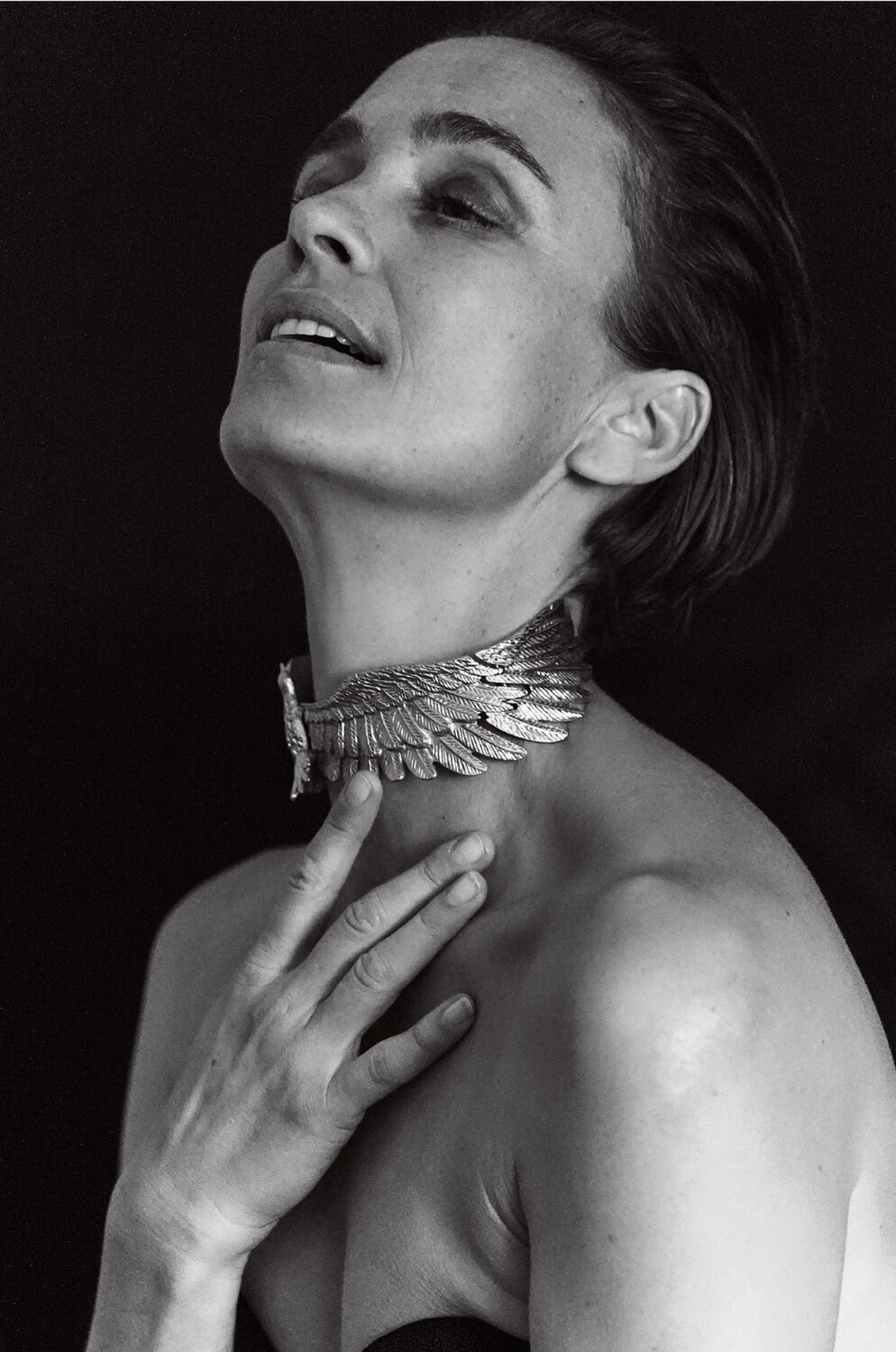 Fine-art black and white portrait of a woman wearing a silver choker